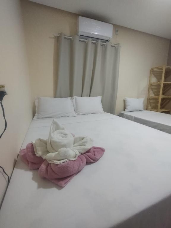 Cama ou camas em um quarto em Pousada Vista da Serra - Suzart
