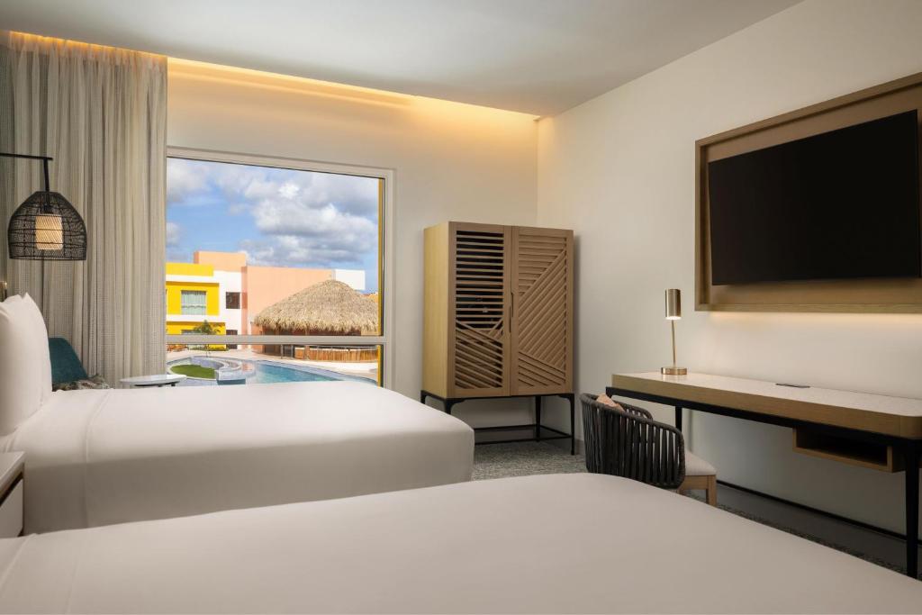 Voodi või voodid majutusasutuse Courtyard by Marriott Curacao toas