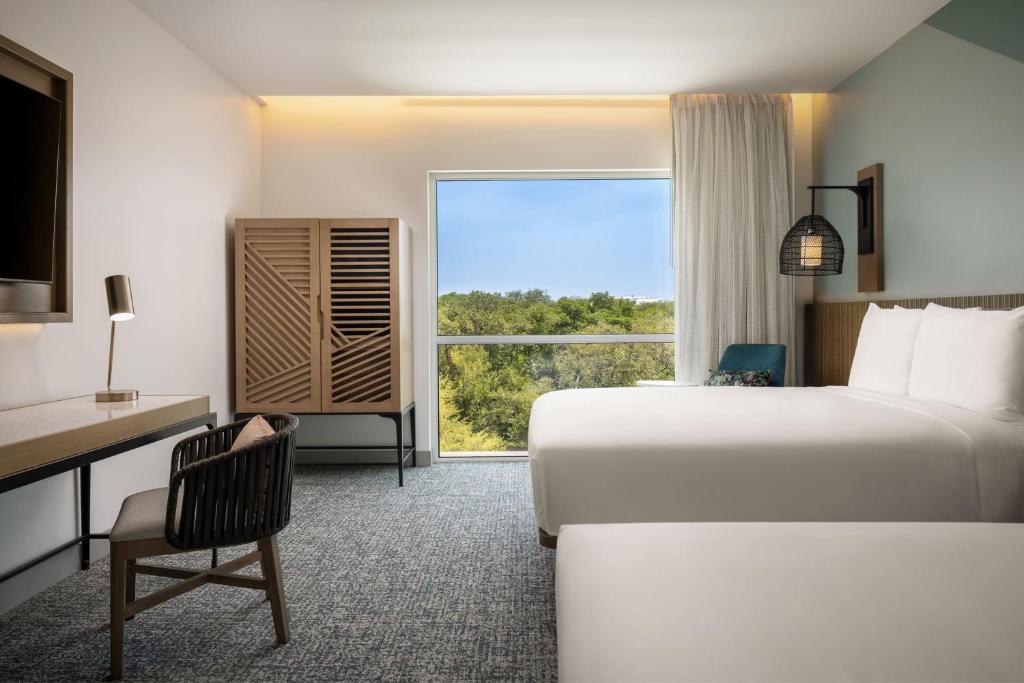 Voodi või voodid majutusasutuse Courtyard by Marriott Curacao toas