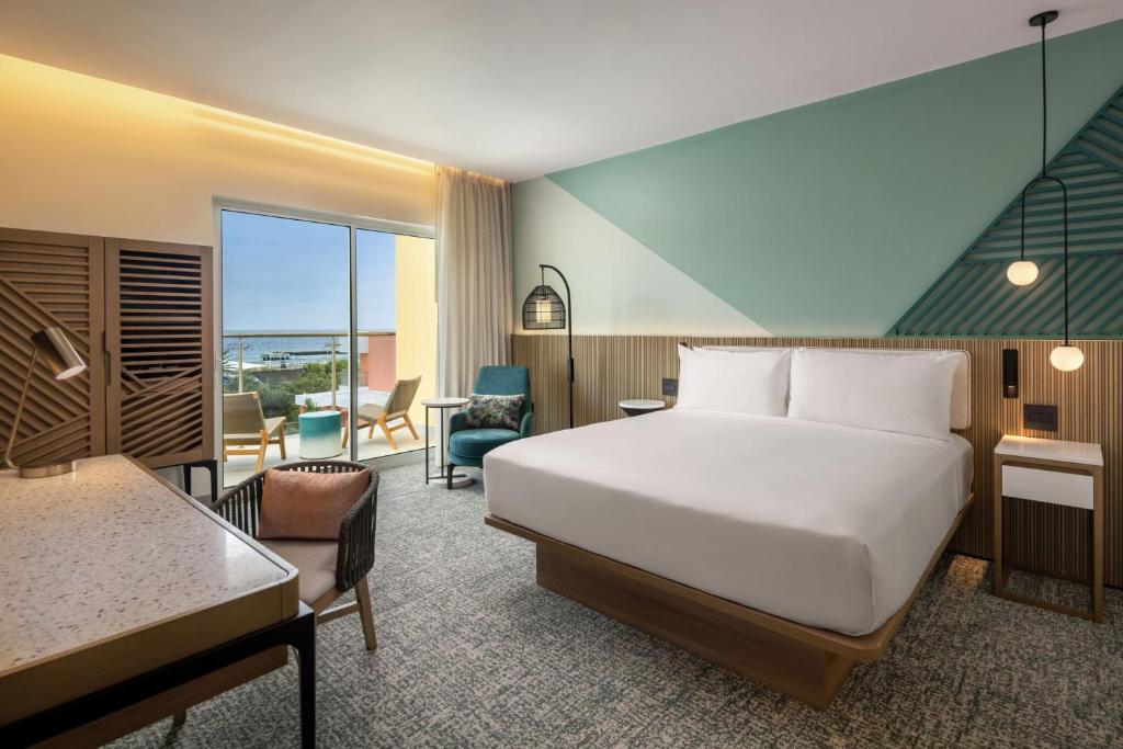 Voodi või voodid majutusasutuse Courtyard by Marriott Curacao toas