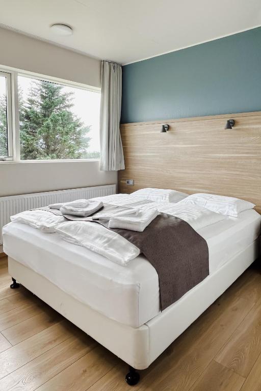 Postel nebo postele na pokoji v ubytování Hotel Jökull