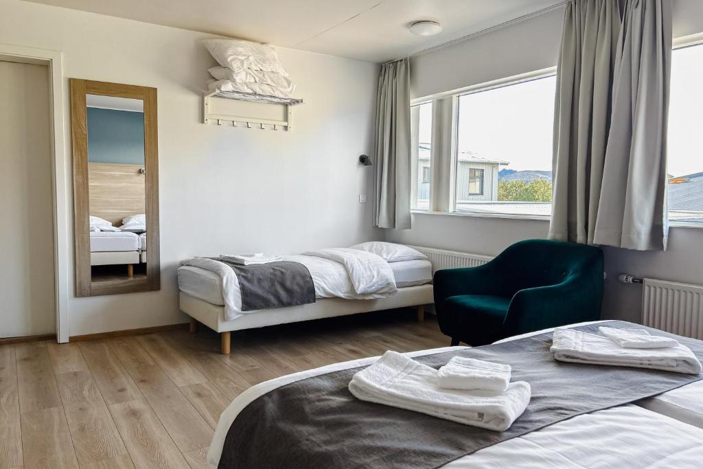 Postel nebo postele na pokoji v ubytování Hotel Jökull