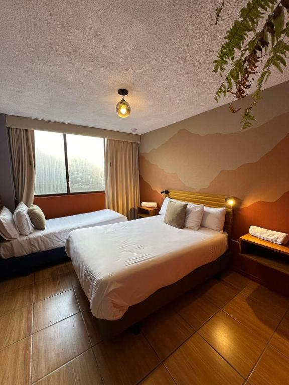 Postel nebo postele na pokoji v ubytování Hotel Agave Baños