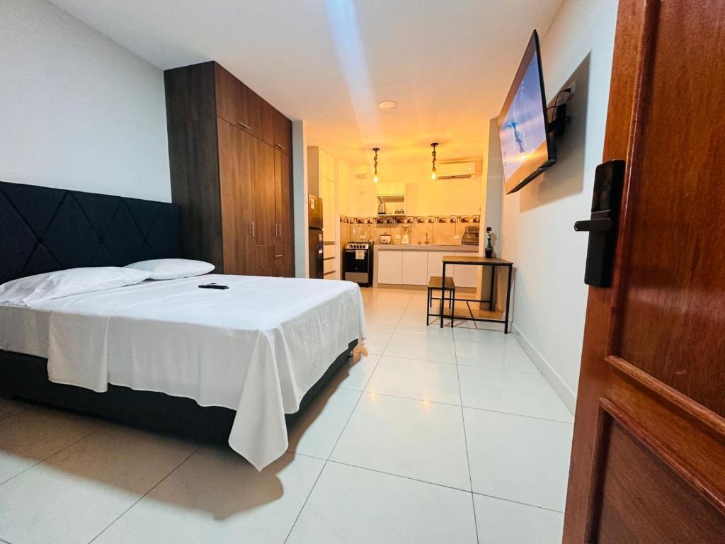 Postel nebo postele na pokoji v ubytování Bienvenido a Casa Estancia