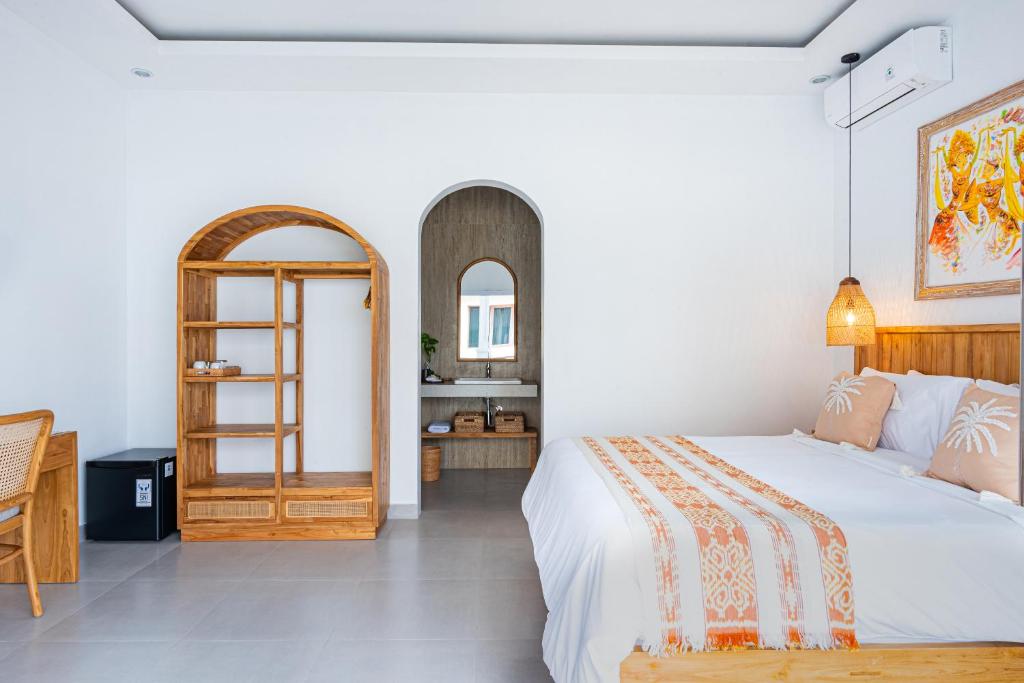 Postel nebo postele na pokoji v ubytování Tirta Mumbul Villa