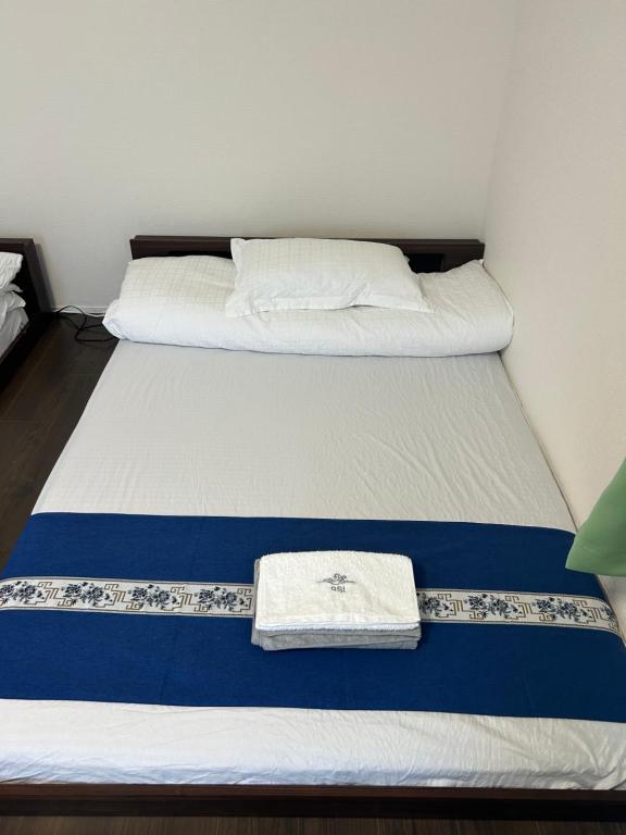 Letto o letti in una camera di 高島市一棟貸切 Biwa Lake琵琶湖 徒歩0分 大人数でご利用だとお得連泊がお得BBQ自転車無料利用可ペット可
