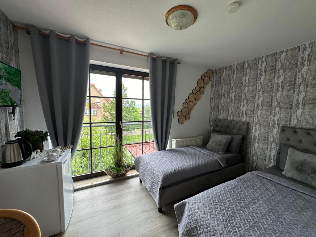 Postel nebo postele na pokoji v ubytování Pension und Monteurzimmer mit Küche und Waschmaschine