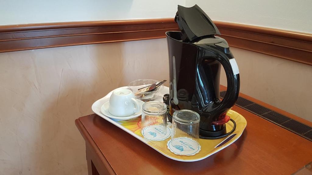 Příslušenství pro přípravu čaje a kávy v ubytování Hotel Minerva