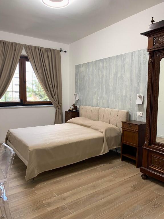 Postel nebo postele na pokoji v ubytování Villa due Scale