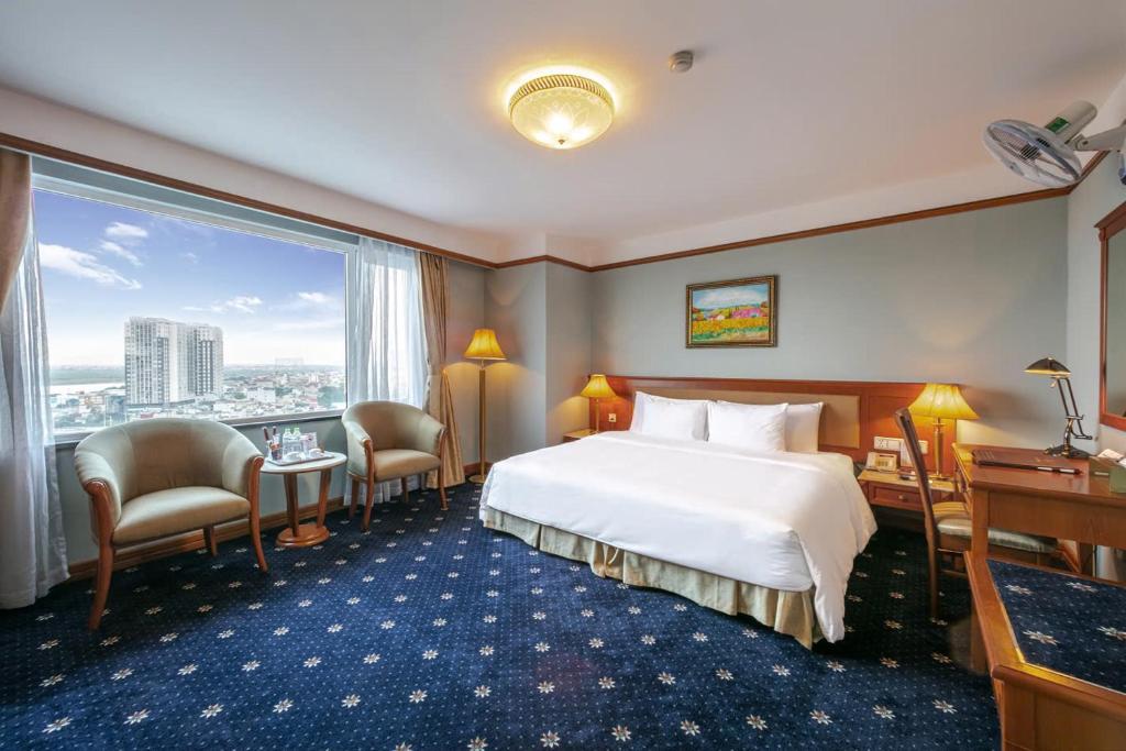 Postel nebo postele na pokoji v ubytování A25 Luxury Hotel