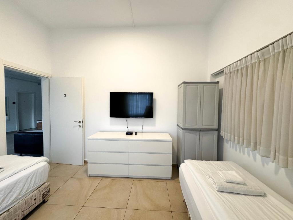Postel nebo postele na pokoji v ubytování Begin19 Apartments & Hostel