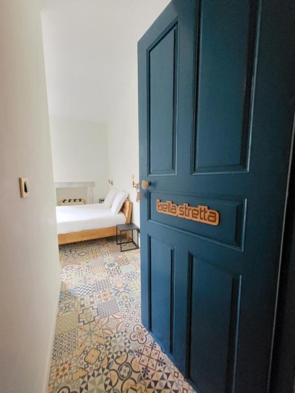 Postel nebo postele na pokoji v ubytování A Bella Scusa