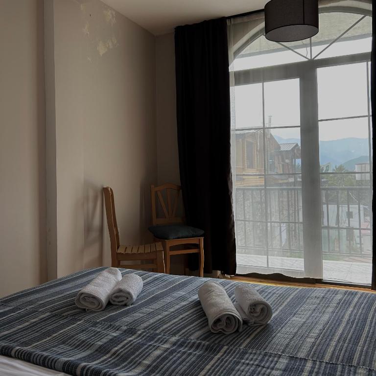 Postel nebo postele na pokoji v ubytování Boutique hotel mestia
