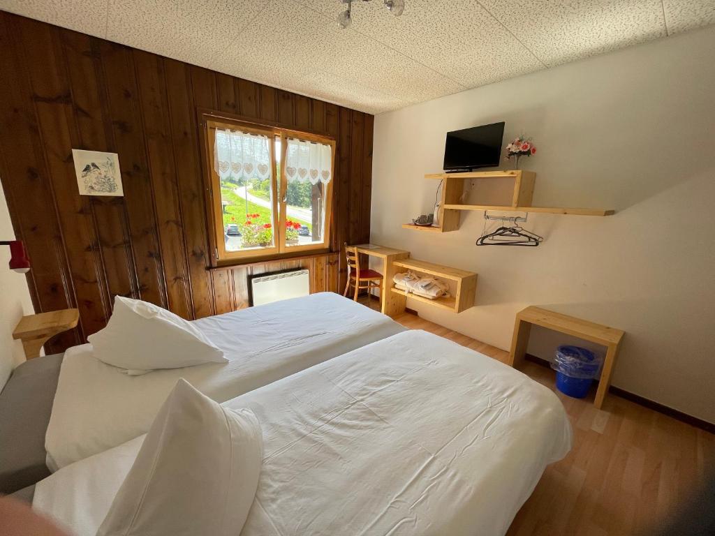 Postel nebo postele na pokoji v ubytování Au Bivouac de Napoléon et Spa