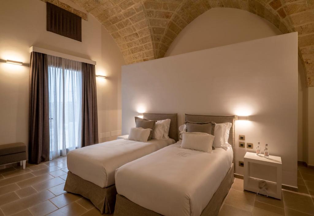 Postel nebo postele na pokoji v ubytování Masseria Corsano