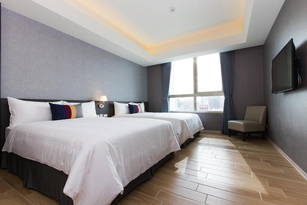 Postel nebo postele na pokoji v ubytování CHECK inn New Taipei LuZhou