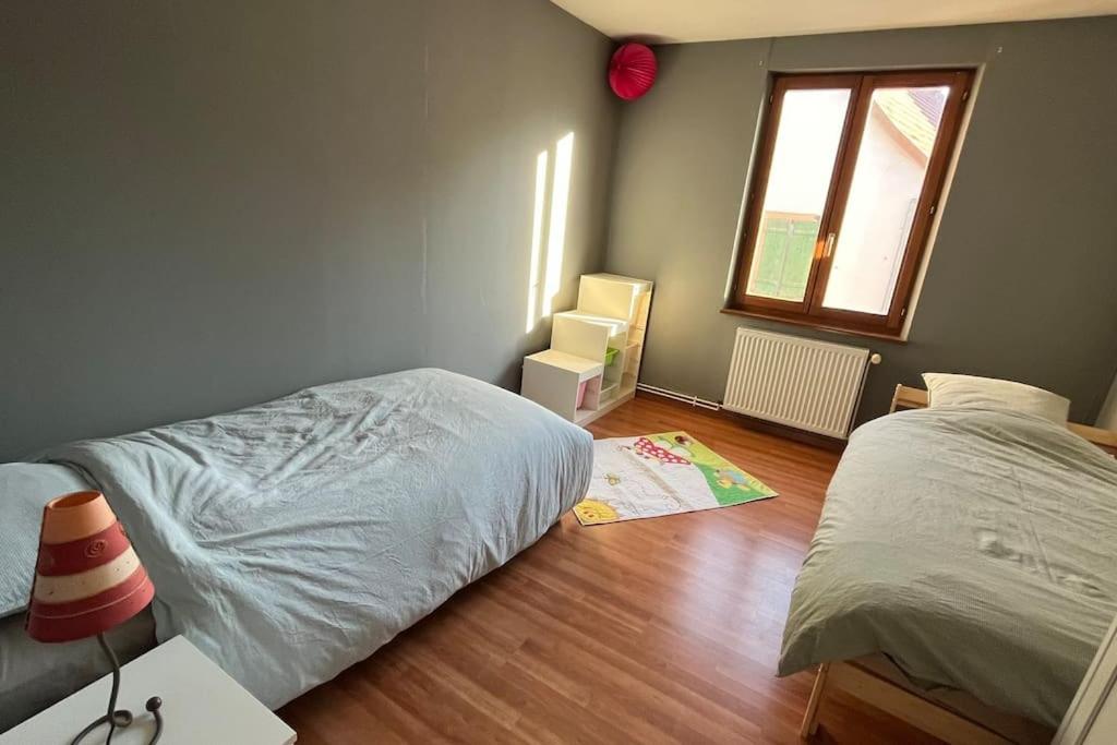 Postel nebo postele na pokoji v ubytování Grand appartement à Barr