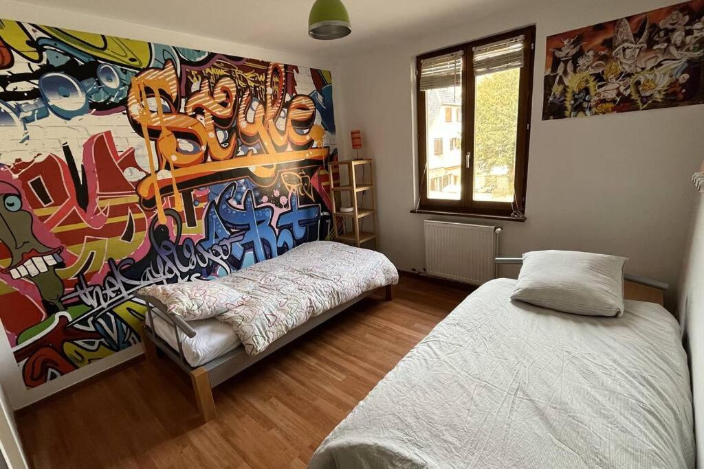 Postel nebo postele na pokoji v ubytování Grand appartement à Barr