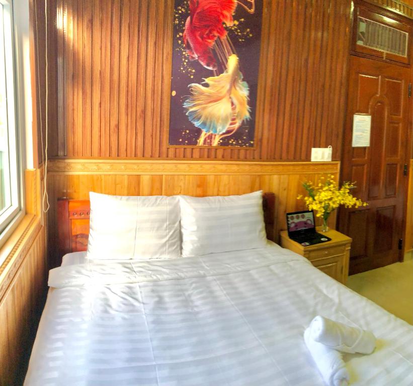 Postel nebo postele na pokoji v ubytování KHÁNH AN HOTEL