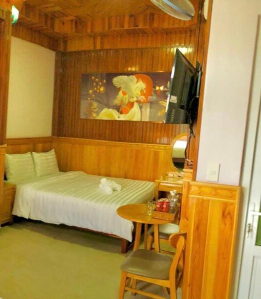 Postel nebo postele na pokoji v ubytování KHÁNH AN HOTEL