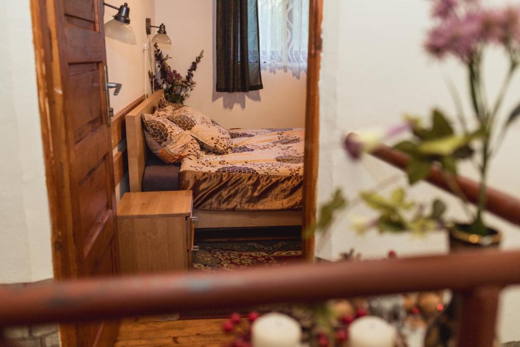 Postel nebo postele na pokoji v ubytování Cabana Huta Sinteu