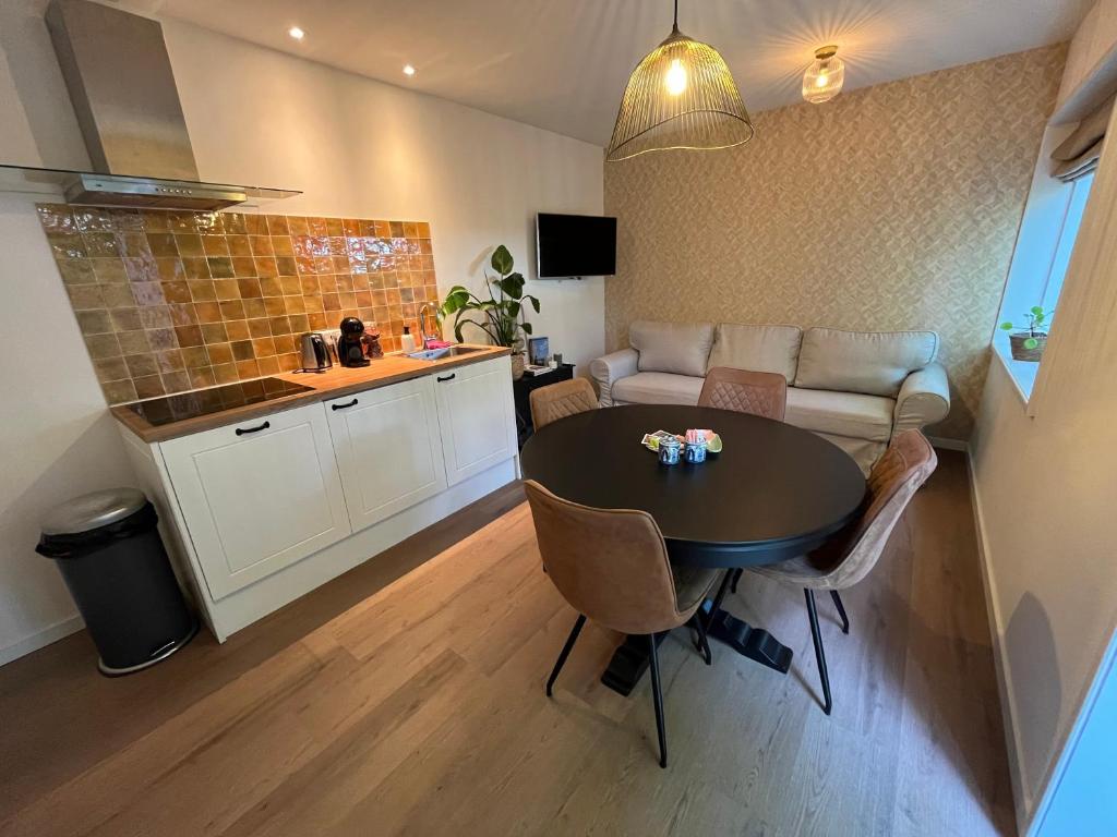 Kuchyň nebo kuchyňský kout v ubytování B&B Bloem 'n Zee