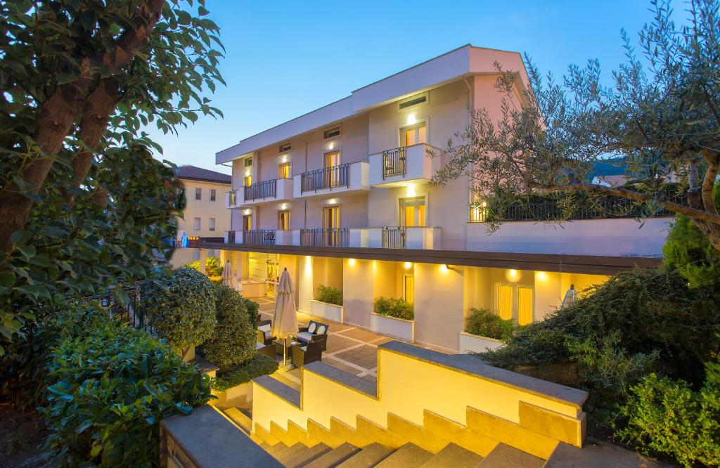 an exterior view of a building with yellow stairs at Virgilio Grand Hotel in Sperlonga