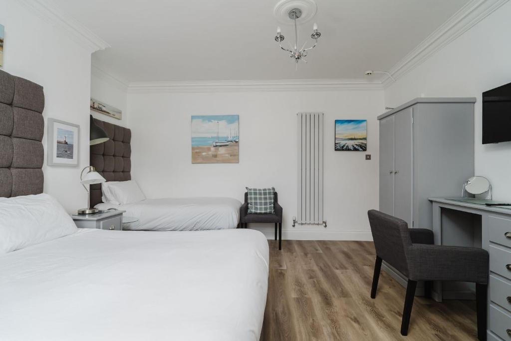 Кровать или кровати в номере The Roxburgh Guest Accommodation
