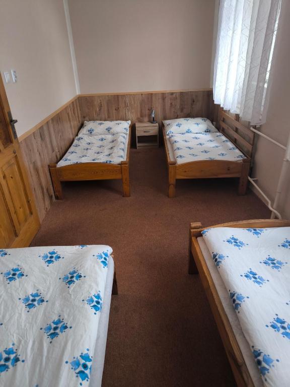 Cama o camas de una habitación en Penzion U Zeleného Stromu