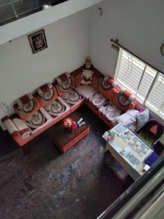 an overhead view of a living room with a couch at Crystal Stay Villa in Chikmagalūr
