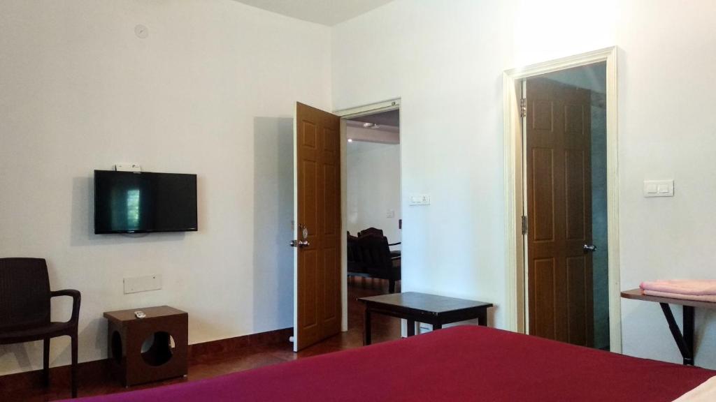 TV a/nebo společenská místnost v ubytování Heights Farm Stay - Coffee Estate Stay