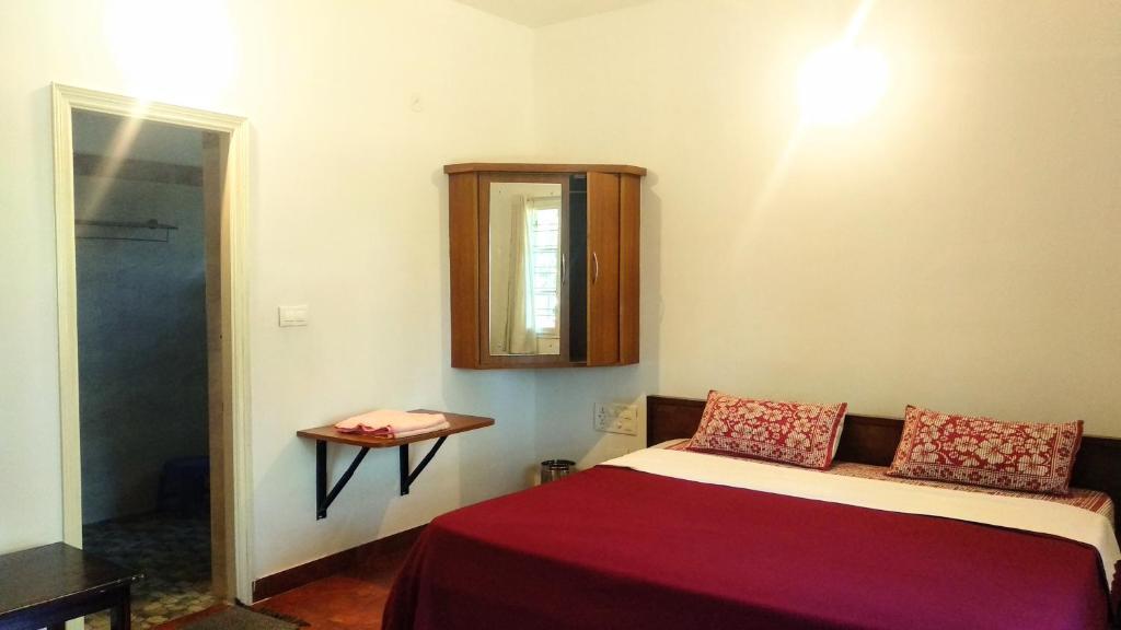 Postel nebo postele na pokoji v ubytování Heights Farm Stay - Coffee Estate Stay
