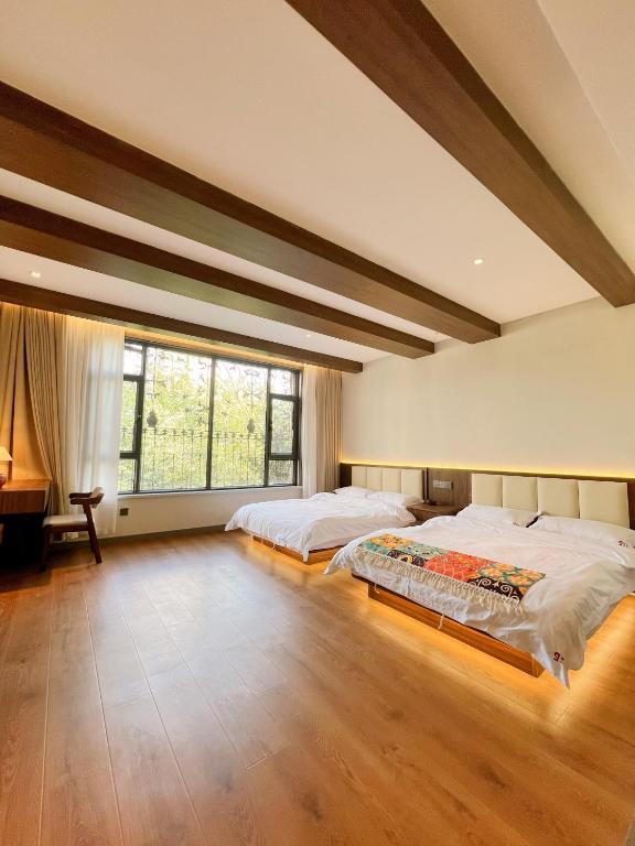 Postel nebo postele na pokoji v ubytování Kashgar QIu Ge Homestay