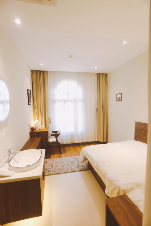 Postel nebo postele na pokoji v ubytování Kashgar QIu Ge Homestay