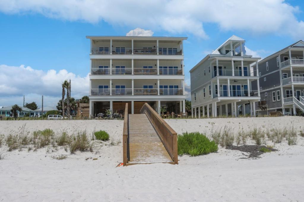 a stairway leading to a building on the beach at The Great White 1 by Pristine Properties Vacation Rentals in Beacon Hill