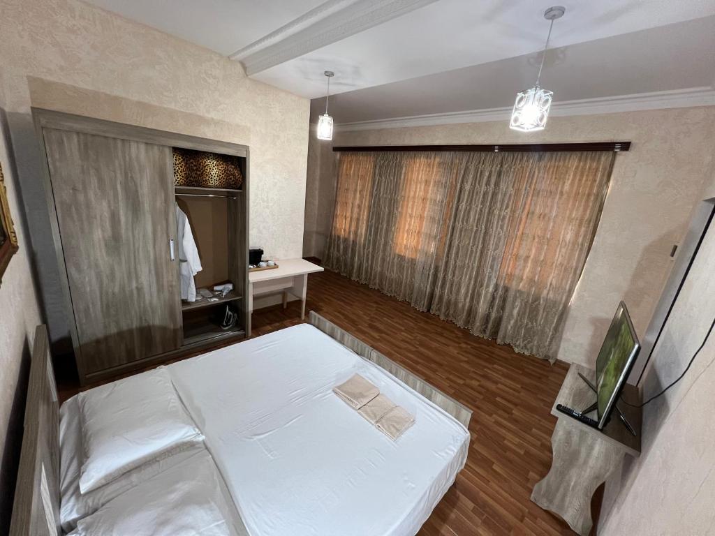Postel nebo postele na pokoji v ubytování Nugo Villa