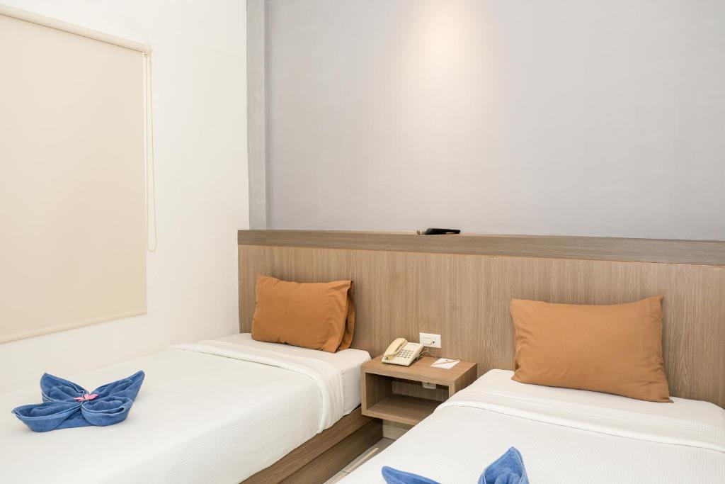 Postel nebo postele na pokoji v ubytování Hotel Dalu