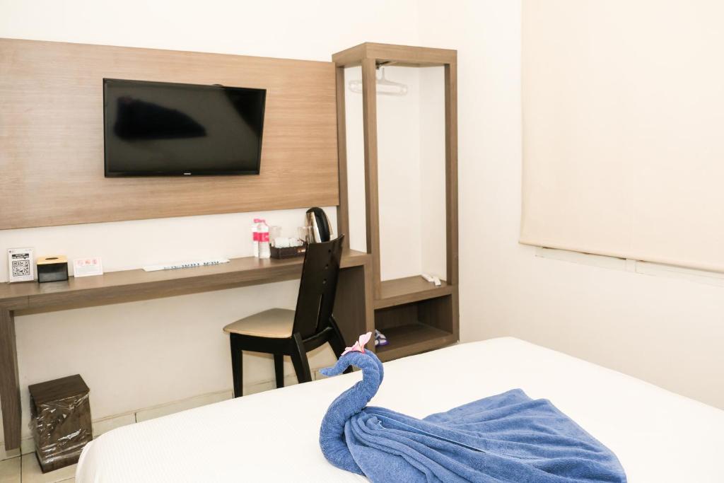 Postel nebo postele na pokoji v ubytování Hotel Dalu