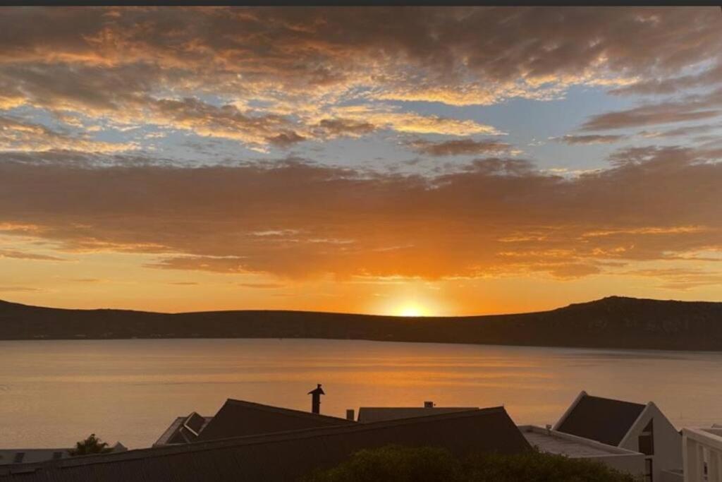 a sunset over a large body of water at Lagoon Views at Langebaan in Langebaan