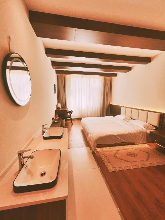 Postel nebo postele na pokoji v ubytování Kashgar QIu Ge Homestay