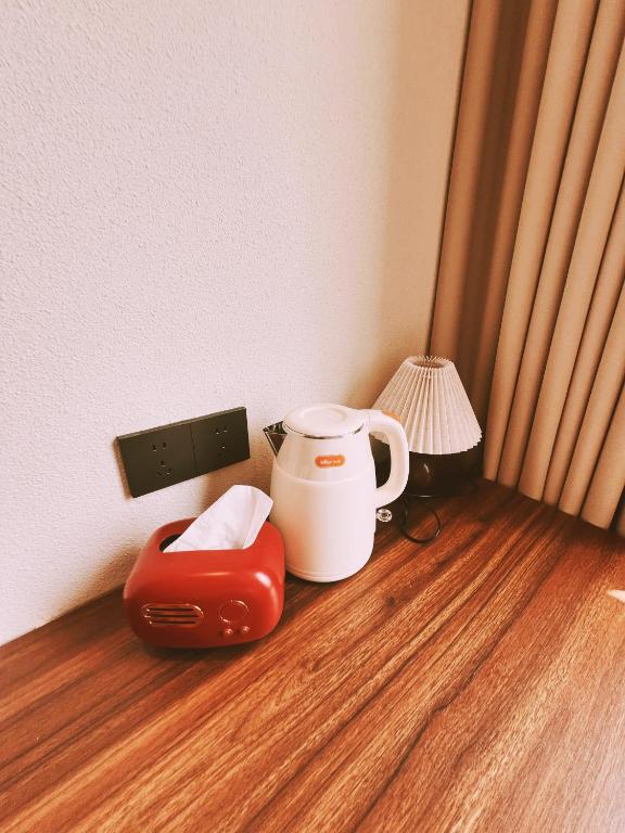 Příslušenství pro přípravu čaje a kávy v ubytování Kashgar QIu Ge Homestay