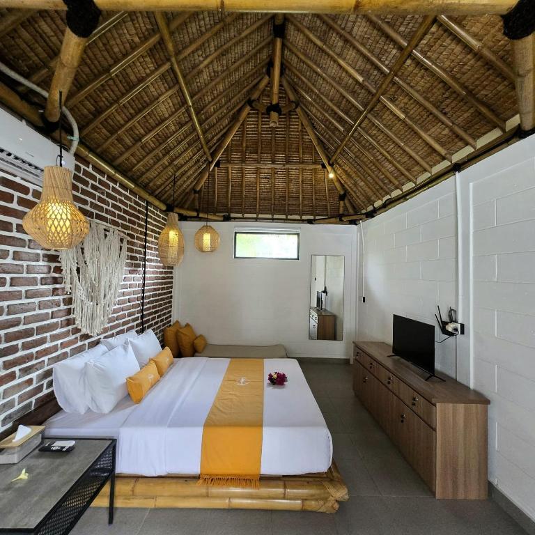 Postel nebo postele na pokoji v ubytování Kampoeng Villa Ubud