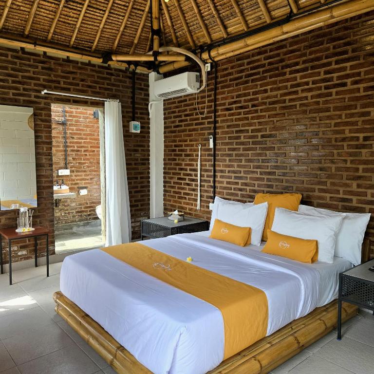 Postel nebo postele na pokoji v ubytování Kampoeng Villa Ubud
