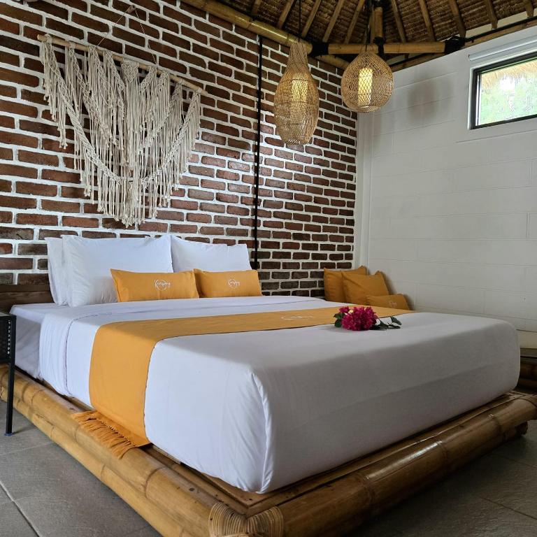 Postel nebo postele na pokoji v ubytování Kampoeng Villa Ubud