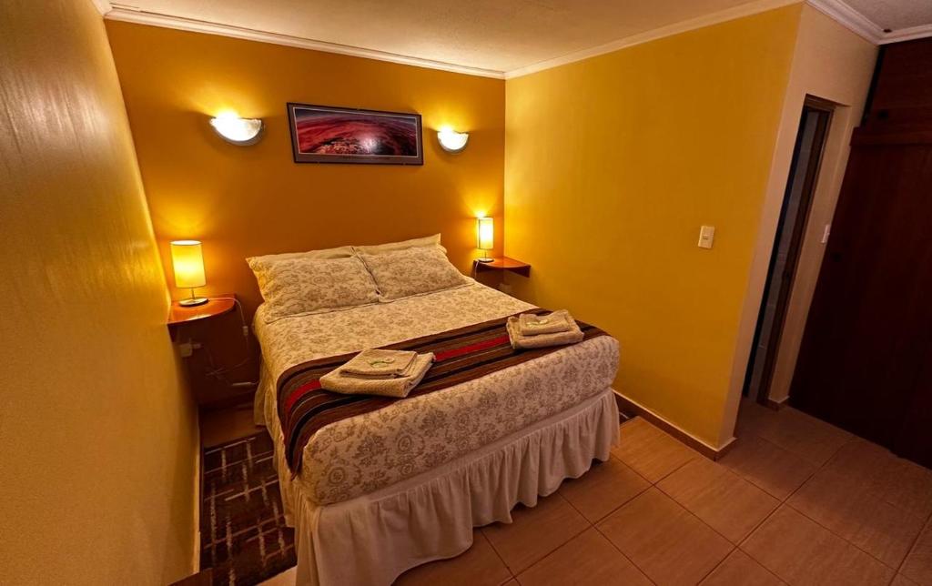 Postel nebo postele na pokoji v ubytování Hostal Solor