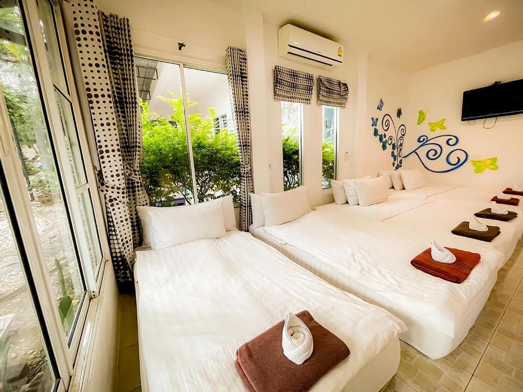 Postel nebo postele na pokoji v ubytování The Light House Resort - Kohlarn เดอะไลท์เฮ้าส์รีสอร์ท เกาะล้าน