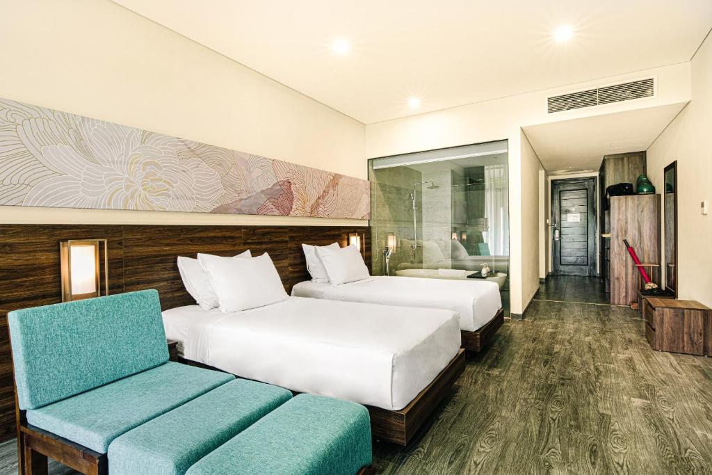 Postel nebo postele na pokoji v ubytování Hoi An Memories Resort & Spa