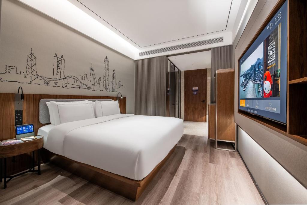 Postel nebo postele na pokoji v ubytování UrCove by Hyatt Shenzhen Bay Nanyou