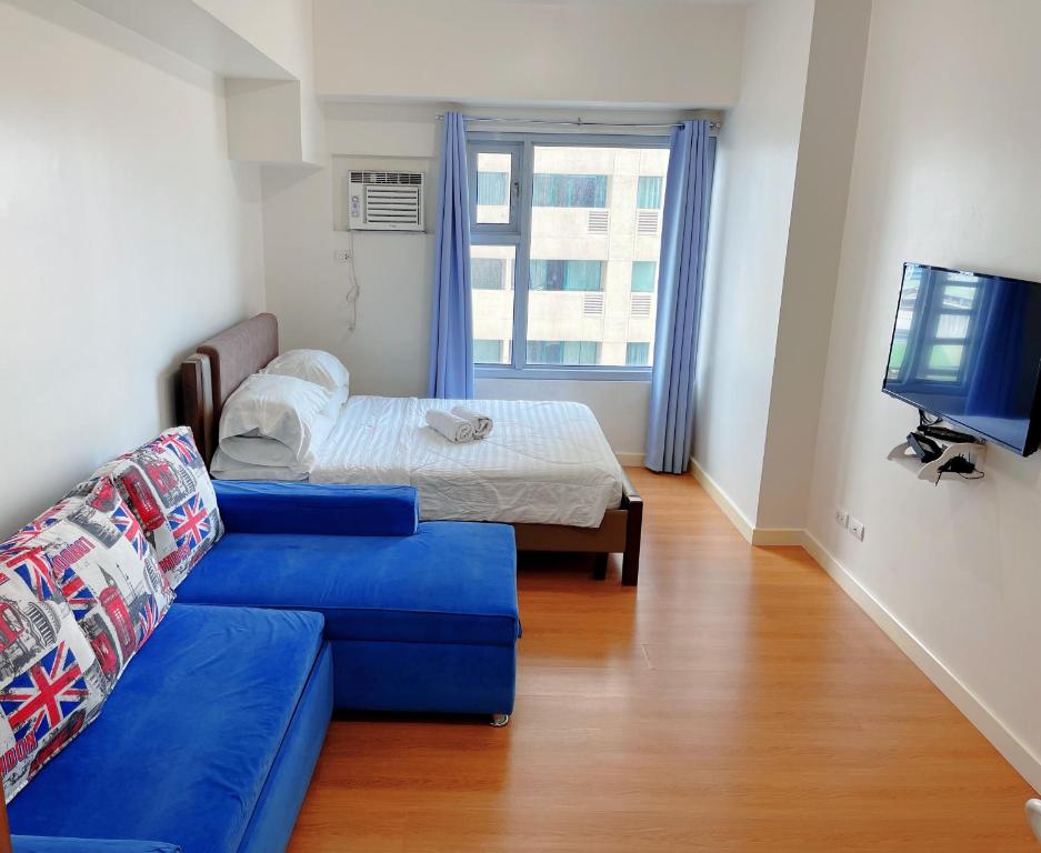 Ένα ή περισσότερα κρεβάτια σε δωμάτιο στο 8 Adriatico Condo near US Embassy