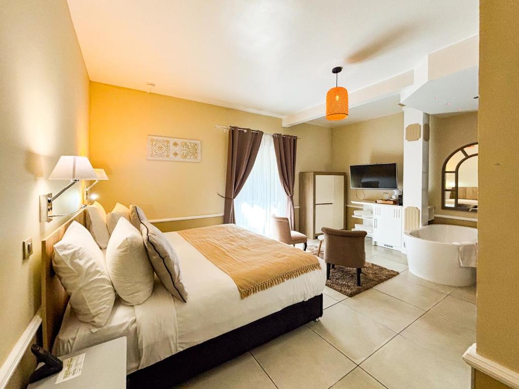 Voodi või voodid majutusasutuse Hotel Le Cilaos toas